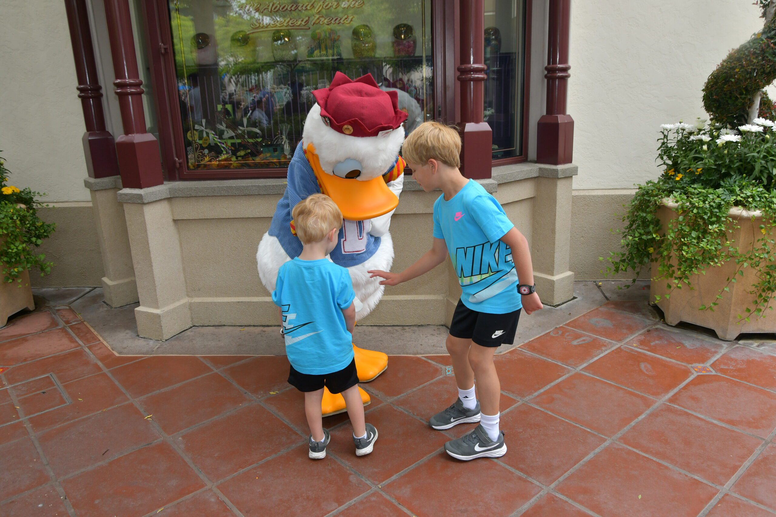 Disneyland's Donald Duck meeting children