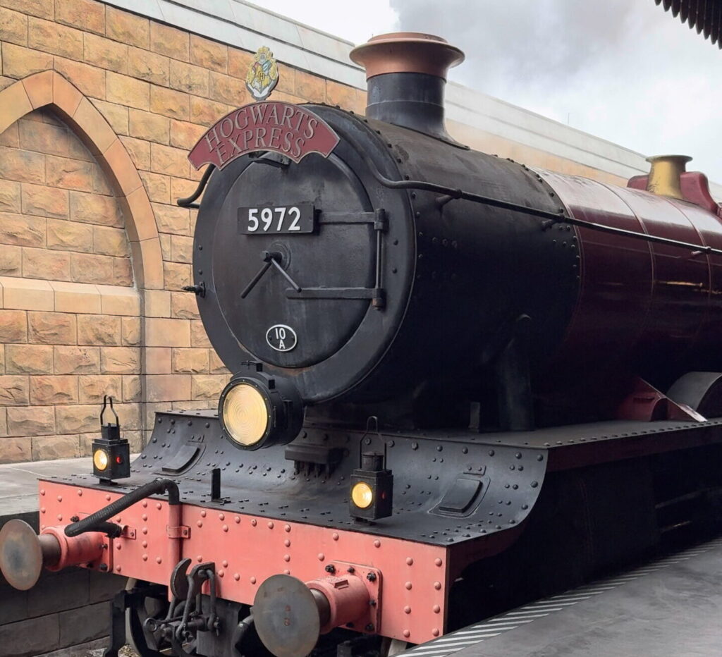 The Hogwarts Express which you can ride between parks